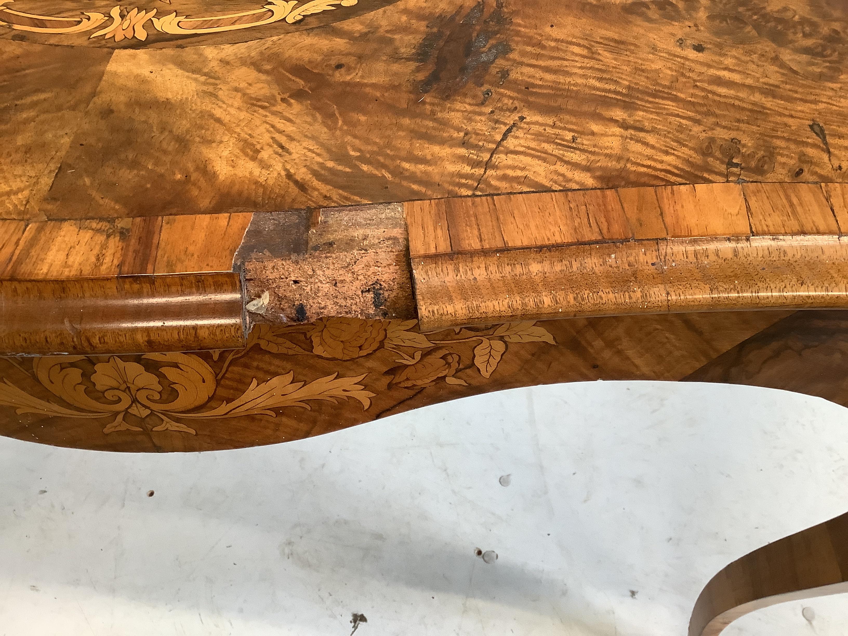 A Victorian marquetry inlaid burr walnut serpentine table, width 104cm, depth 60cm, height 73cm